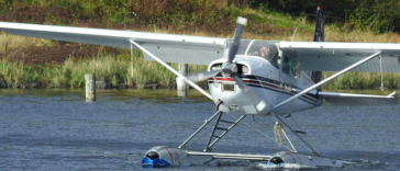Ken Cote flying a C-GDIR, which is a Cessna A185F.