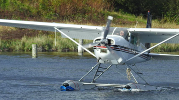 Ken Cote flying a C-GDIR, which is a Cessna A185F.