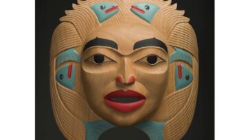 Dale Campbell's "Woman who Brought the Salmon" mask made of alder, abalone and pigment